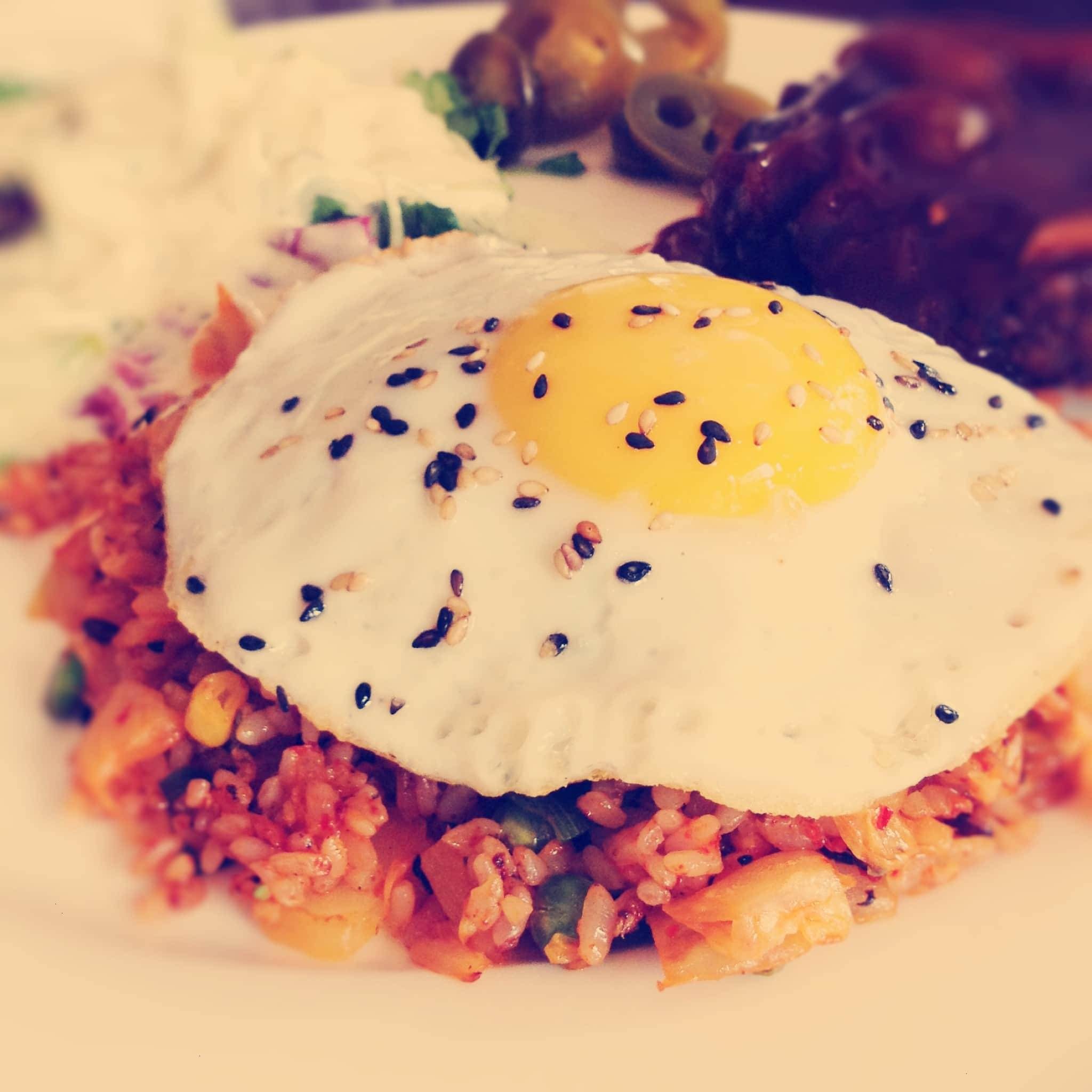 Egg on rice with sesame seeds.