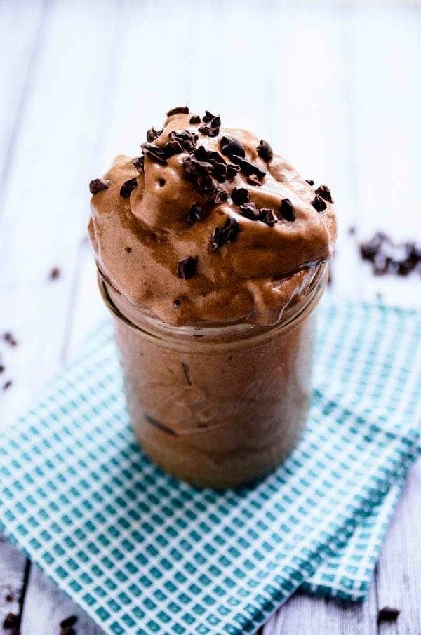 Chocolate smoothie topped with chocolate shavings.