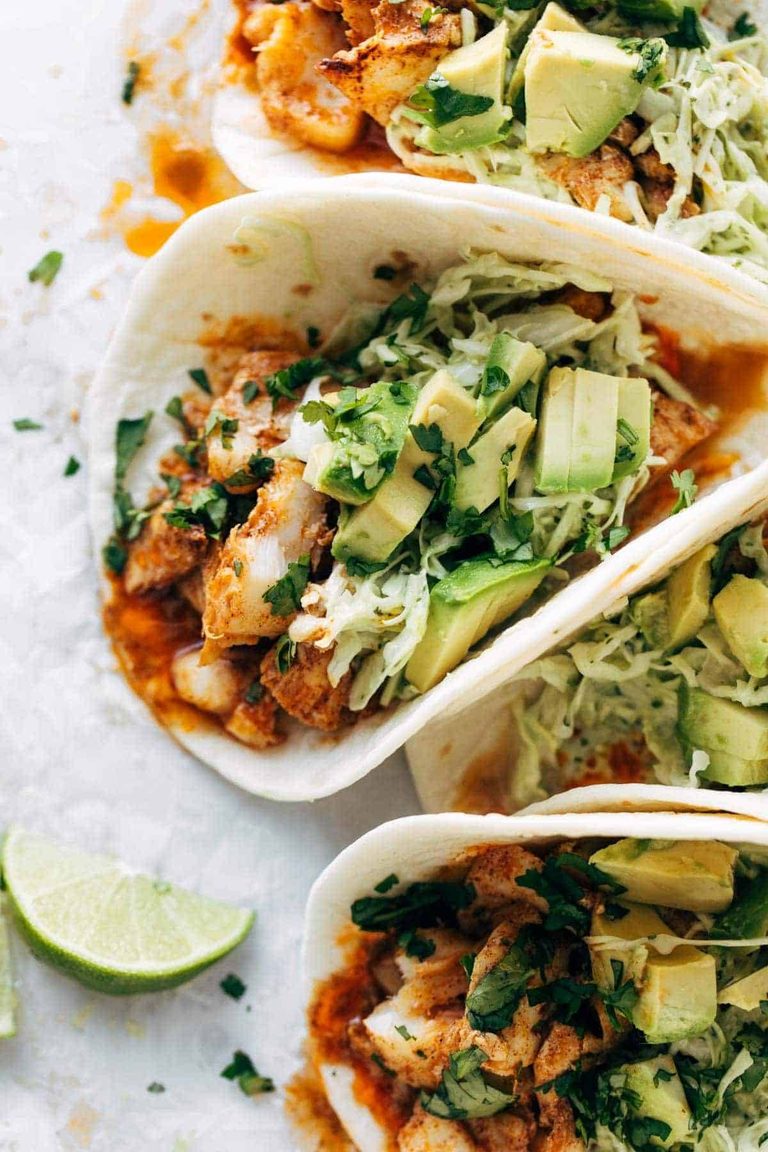 Fish tacos with slaw and avocado.