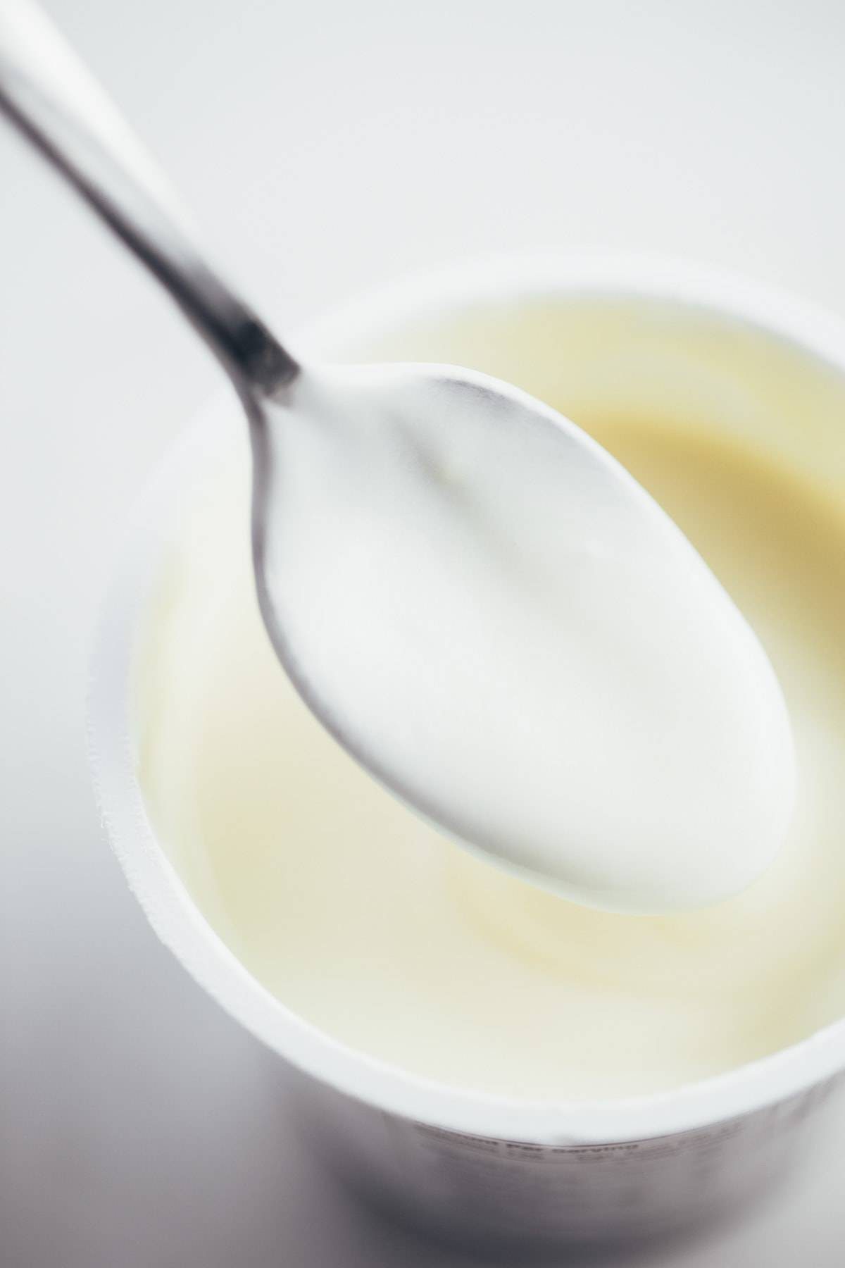 Yogurt on a spoon.