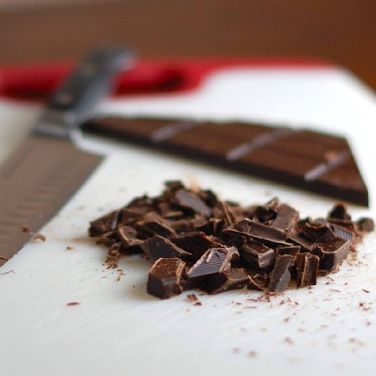 Dark Chocolate chunks on a cutting board.
