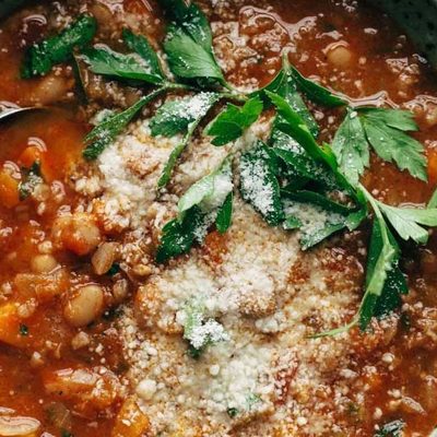 Instant Pot Minestrone Soup in bowl with spoon and bread.