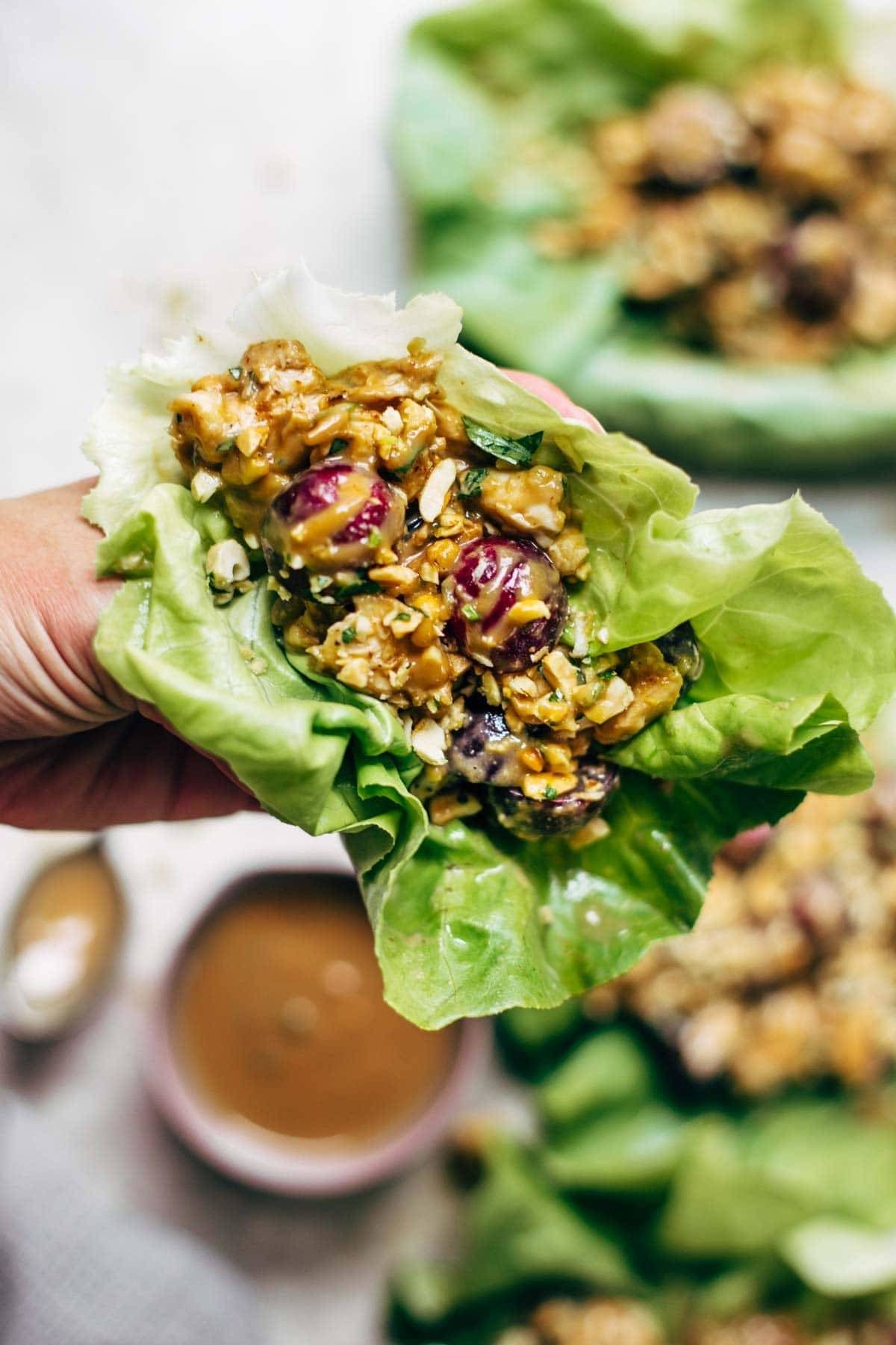 Creamy Miso Peanut Chicken Lettuce Wraps - grilled chicken and juicy grapes tossed with a simple creamy miso-peanut sauce. Super easy and healthy recipe! | pinchofyum.com