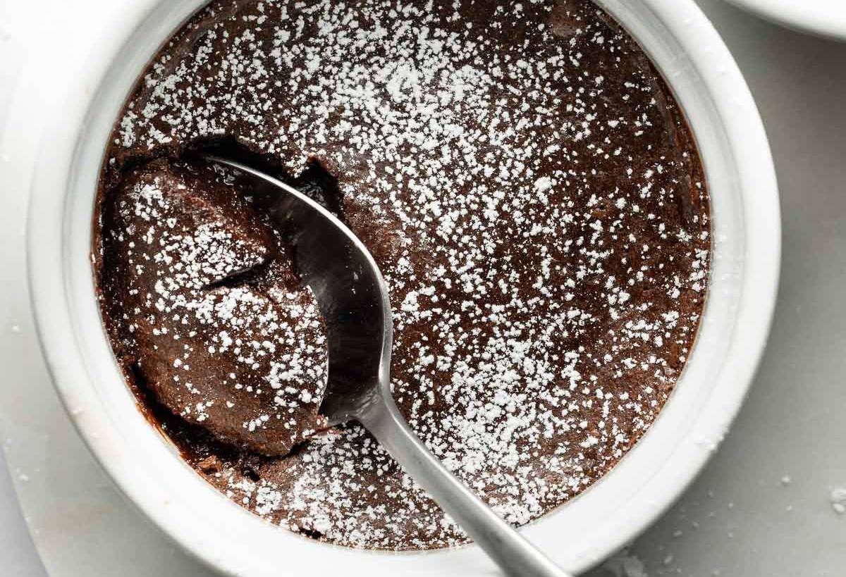 Baked brownie pudding in a ramekin.
