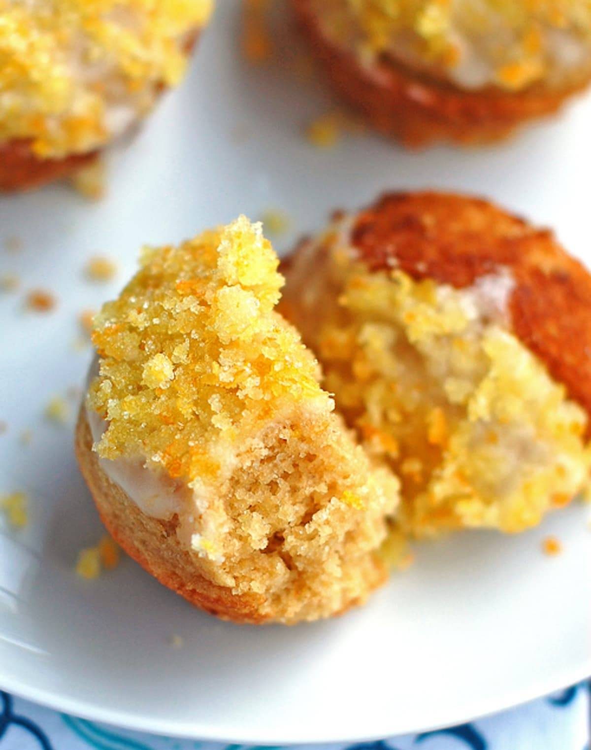 Whole wheat glazed orange muffins topped with a sugary zest. 