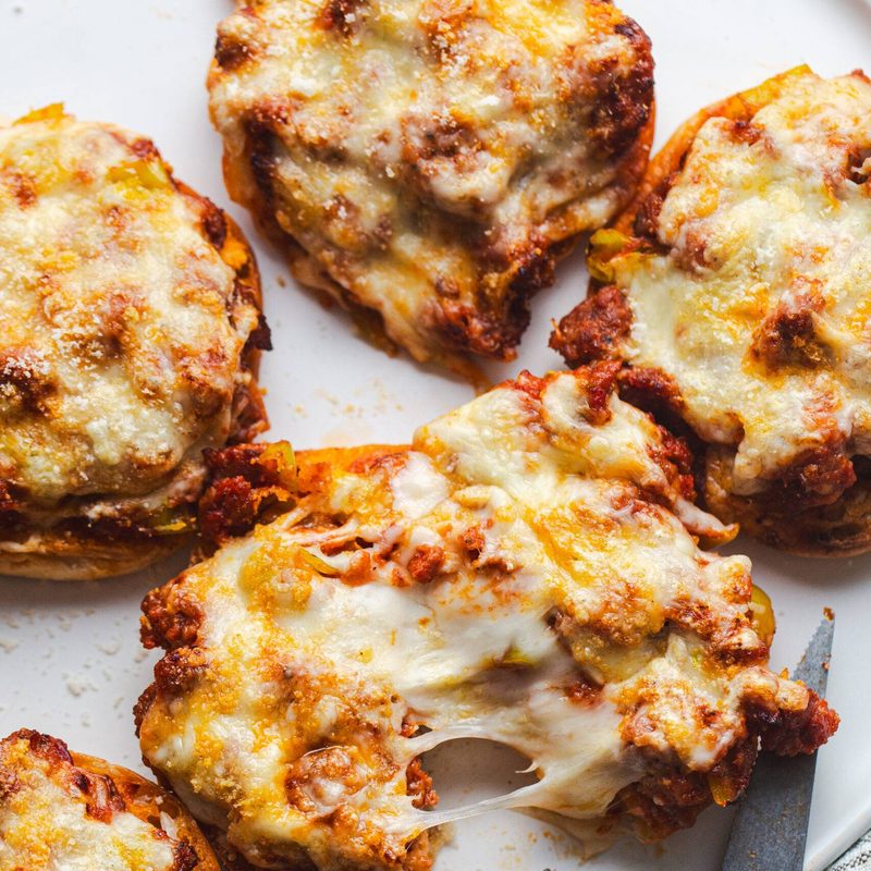 Pizza burgers on a tray.