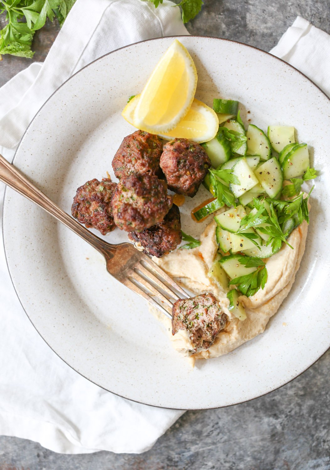 Overhead close-up of the interior of a spiced lamb meatball. 