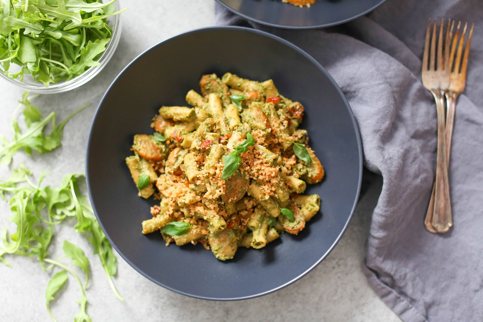 Sausage and Sun-Dried Tomato Pasta with Arugula-Goat Cheese Pesto