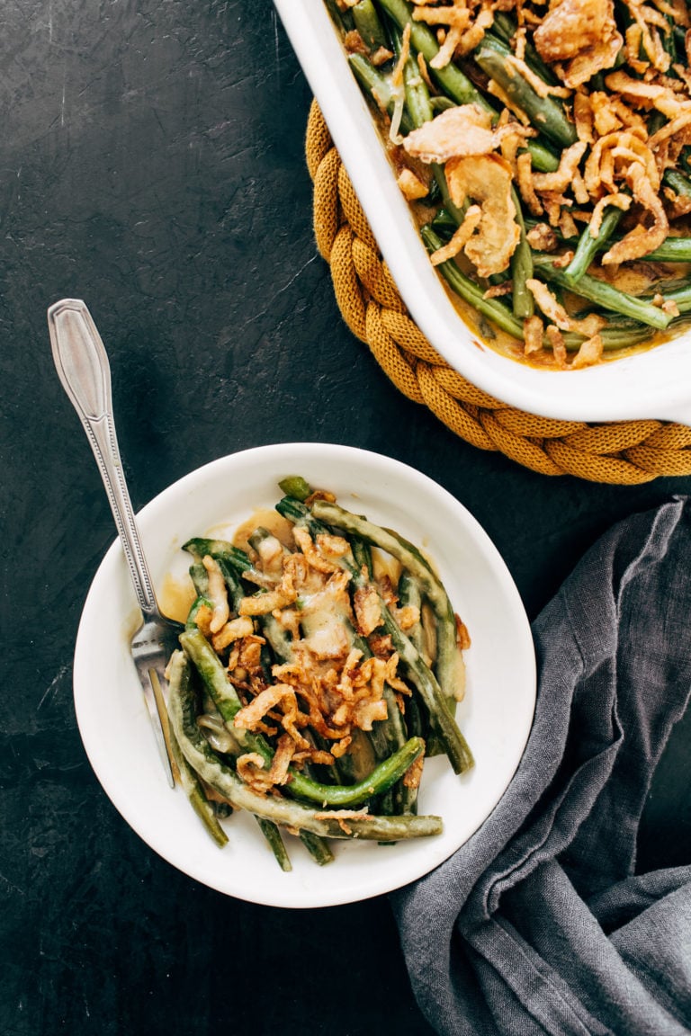 Green bean casserole on a plate with a fork.