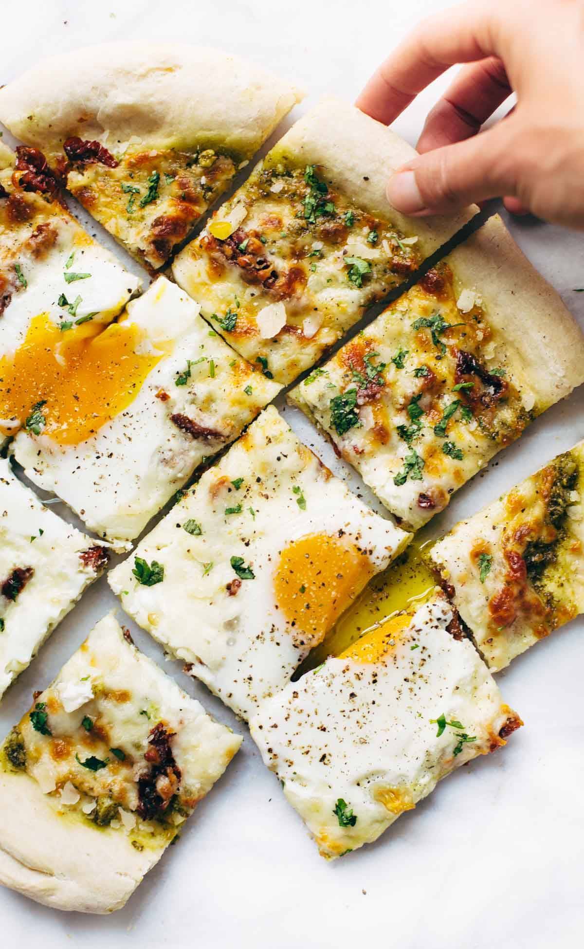 Breakfast Pizza cut into squares.