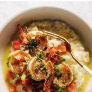 Pesto shrimp and parmesan risotto in a bowl pin