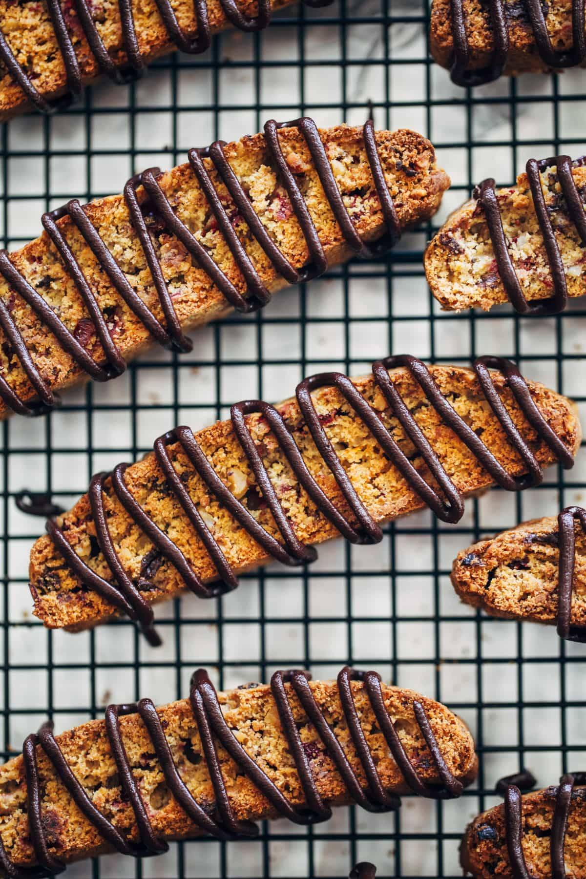 Cranberry Dark Chocolate Biscotti on a drying rack.