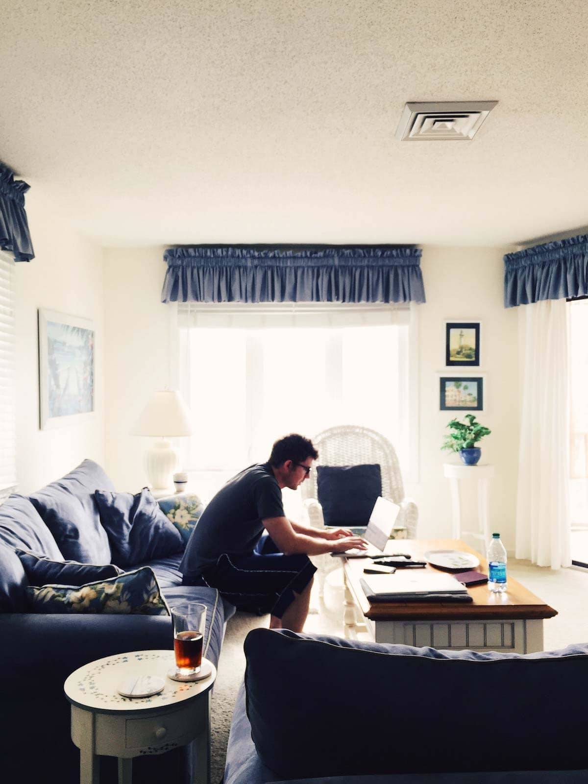 Man working in a resort room.